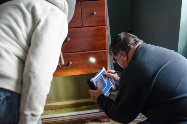FEMA Inspector Richard Martin inspects a basement apartment in Hoboken two days after the residents applied for FEMA assistance. FEMA is working with many partners and organizations to provide assistance to residents affected by Hurricane Sandy.
