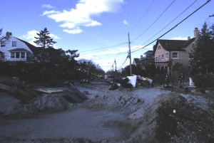 Debris and packed sand fills a street near the the beach in Belle Harbor a week after the storm hit. Three weeks after the storm, concerns are setting in about how poor air quality could affect students.