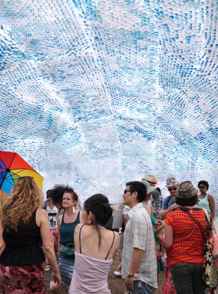 Visitors explore a structure build out of 53,780 plastic bottles -- the number thrown away in New York City every hour.